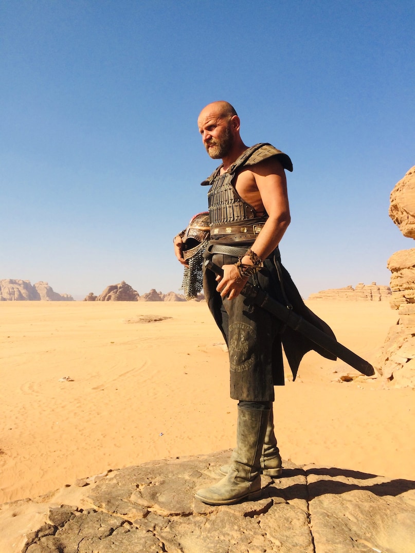 Desert Warrior Box Office Disaster, Biggest Flop Movie In Cinema History, Saudi Arabia Hollywood Film 2026, Desert Warrior Budget Loss, Rupert Wyatt Director Desert Warrior, डेजर्ट वॉरियर बॉक्स ऑफिस फ्लॉप, इतिहास की सबसे बड़ी फ्लॉप फिल्म, सऊदी अरब हॉलीवुड फिल्म 2026, डेजर्ट वॉरियर फिल्म बजट नुकसान, रूपर्ट वायट निर्देशक डेजर्ट वॉरियर