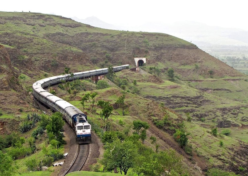 Train journeys have always been one of the best ways to soak in India's diverse landscapes. But with Vistadome coaches that featuries oversized glass windows, transparent roofs, rotating seats and observation decks, the experience becomes even more immersive. Whether you're gliding through the misty Himalayas, the lush Western Ghats or the tea gardens of the Dooars, these routes promise breathtaking views from start to finish.