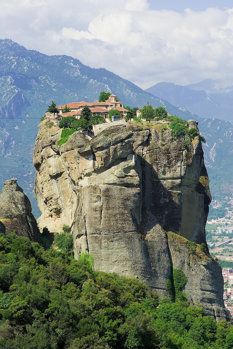 Holy Trinity Monastery (Greece): Suspended atop a dramatic, 400 meter sandstone pillar in the Meteora region, this Eastern Orthodox sanctuary dates back to the 14th century. Once reached only by rope nets, visitors now scale 140 steep steps cut directly into rock faces.