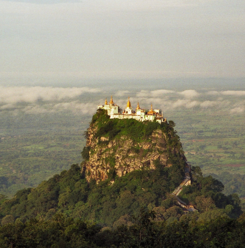Taung Kalat (Myanmar): Perched dramatically atop a sheer volcanic plug rising 737 meters high, this breathtaking Buddhist shrine commands panoramic views. Pilgrims must ascend 777 covered steps barefoot, passing playful macaques, to reach the summit, which is sacred to legendary Burmese spirits. 
