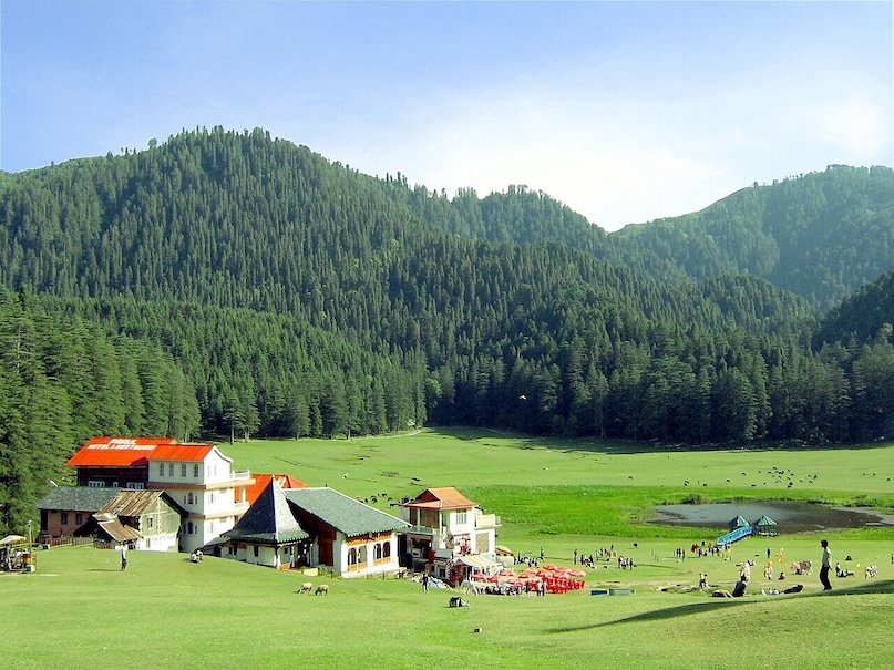 Khajjiar, Himachal Pradesh: Dubbed the "Mini Switzerland of India," this breathtaking meadow turns exceptionally lush during the monsoon. Surrounded by dense deodar forests and a central lake under heavy, dramatic skies, it perfectly captures the serene essence of a quiet Swiss countryside. Khajjiar, Himachal Pradesh: Dubbed the "Mini Switzerland of India," this breathtaking meadow turns exceptionally lush during the monsoon. Surrounded by dense deodar forests and a central lake under heavy, dramatic skies, it perfectly captures the serene essence of a quiet Swiss countryside.