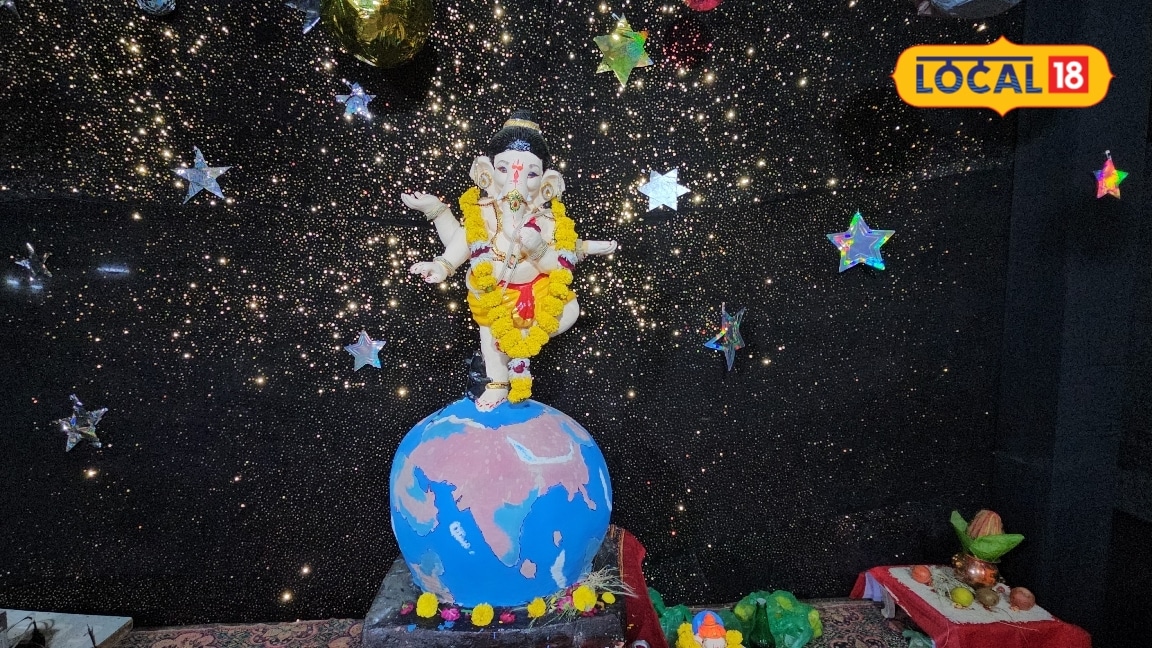 Barmer Ganesh Festival: Celestial theme unveiled at Barmer pandal, deity enshrined amidst planetary display.