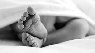 Newborn Girl Found Abandoned with Injuries Amidst Bushes and Garbage in Churu