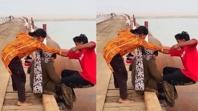 Couple falls straight into the sea while making a reel