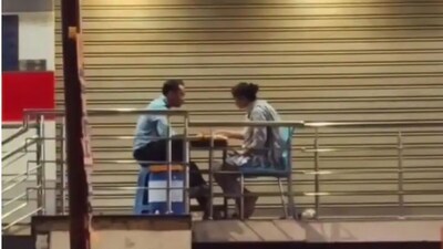 Security Guard's Simple Dinner With Wife Outside Bank Wins Hearts Online