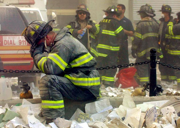 A firefighter breaks down after the World Trade Center buildings collapsed September 11, 2001 after two hijacked airplanes slammed into the twin towers in a terrorist attack.