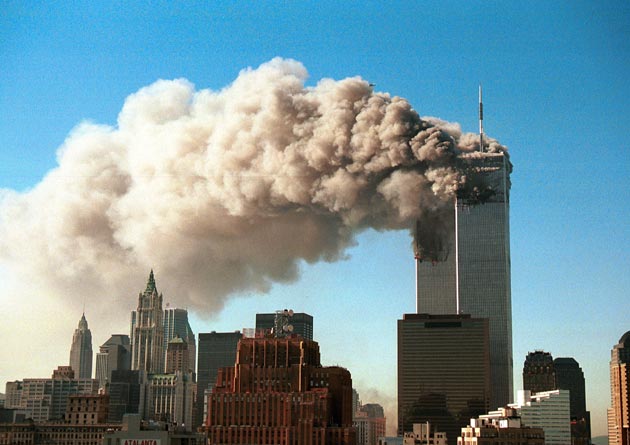 Smoke pours from the twin towers of the World Trade Center after they were hit by two hijacked airliners in a terrorist attack September 11, 2001 in New York City.