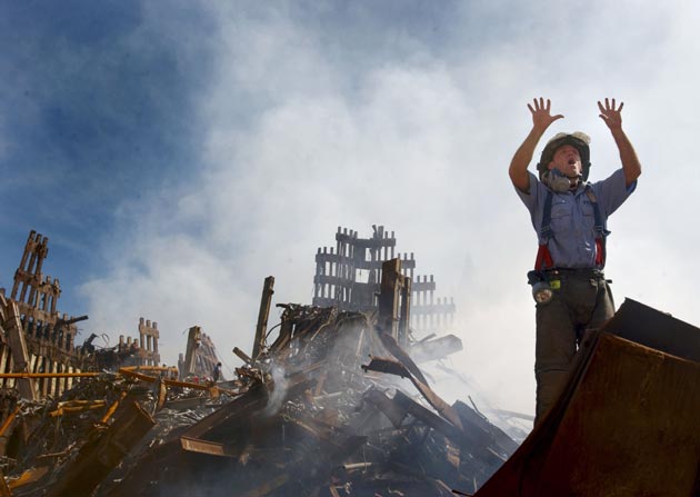A New York City fireman calls for 10 more rescue workers to make their way into the rubble of the World Trade Center September 14, 2001 days after the September 11, 2001 terrorist attack.