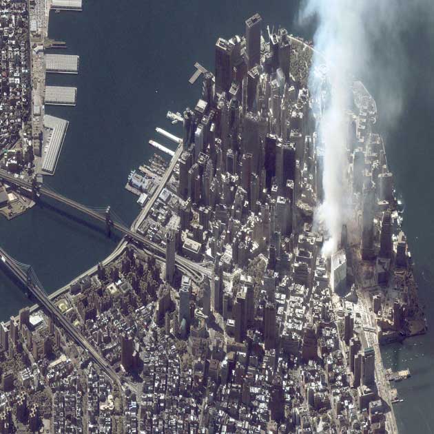 A satellite image of lower Manhattan shows smoke and ash rising from the site of the World Trade Center at 11:43 a.m. September 12, 2001 in New York City.