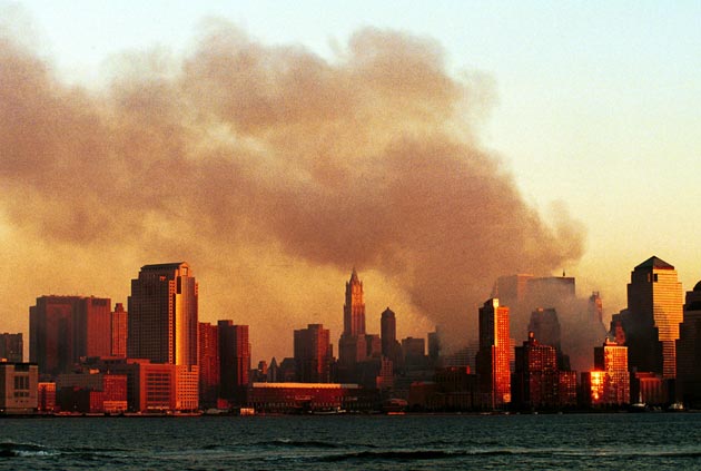 Smoke pours from the former site of the World Trade Center in Manhattan September 12, 2001 from a vantage point in Hoboken, NJ. Smoke filled the air all over lower Manhattan in the aftermath of Tuesday's terrorist attack and destruction of the World Trade Center.