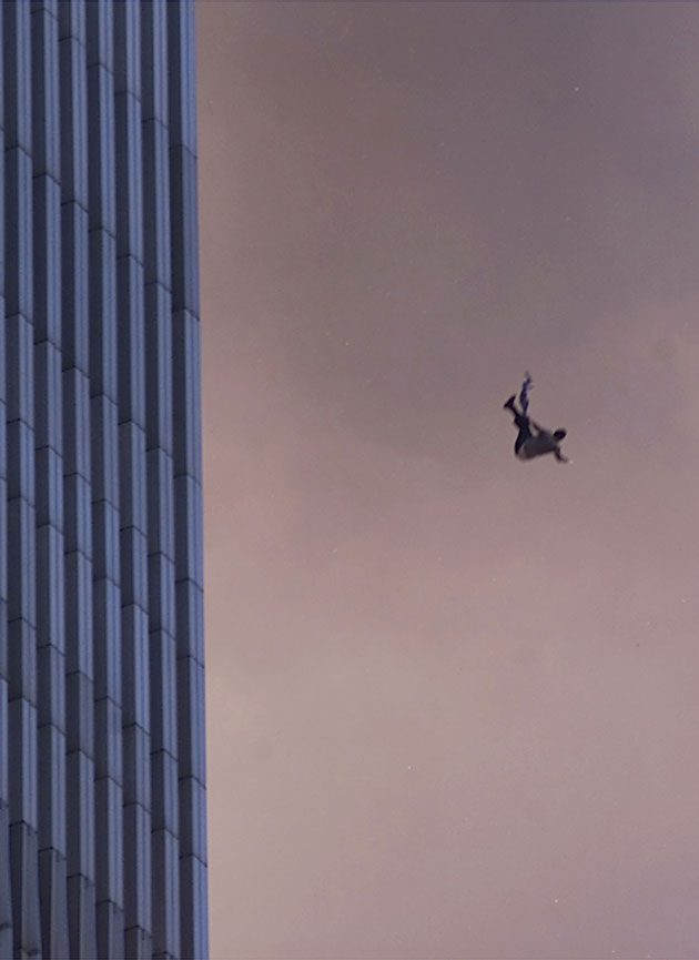 A person falls to his death from the World Trade Center after two planes hit the Twin Towers September 11, 2001 in New York City.