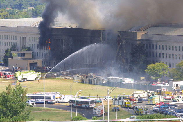 Smoke comes out from the west wing of the Pentagon building September 11, 2001 in Arlington, after a plane crashed into the building and set off a huge explosion.