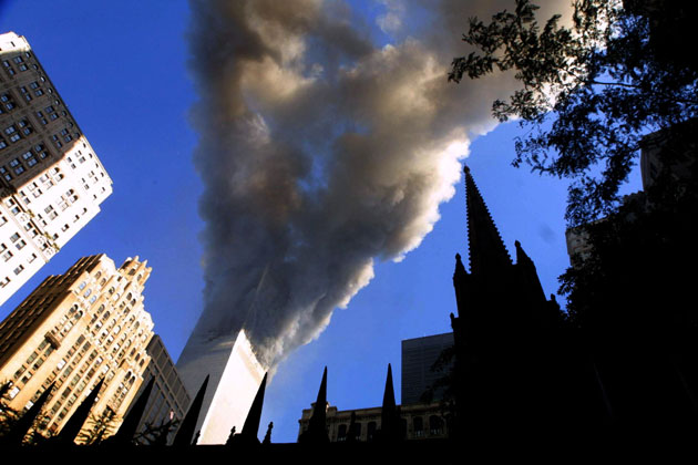 Smoke spews from a tower of the World Trade Center September 11, 2001 after two hijacked airplanes hit the twin towers in an alleged terrorist attack on New York City.
