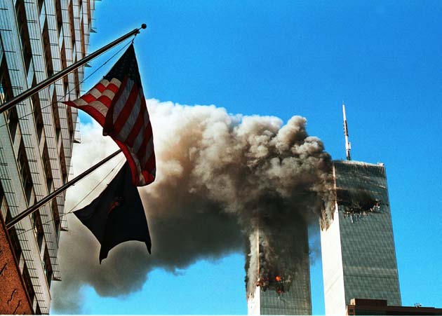 Smoke pours from The World Trade Center after being hit by two planes September 11, 2001 In New York City.