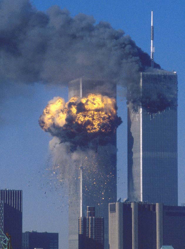 The World Trade Center south tower (L) burst into flames after being struck by hijacked United Airlines Flight 175 as the north tower burns following an earlier attack by a hijacked airliner in New York City in this photo taken September 11, 2001.