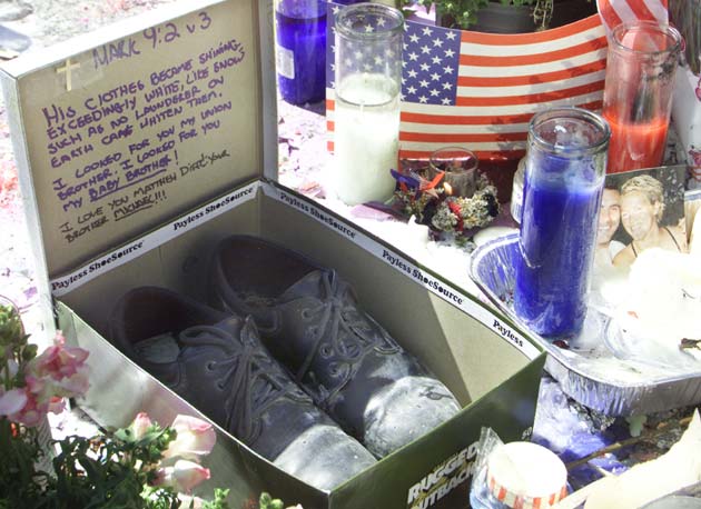 A pair of shoes sit in a box in Union Square, a memorial site for the World Trade Center attack in New York, September 17, 2001.