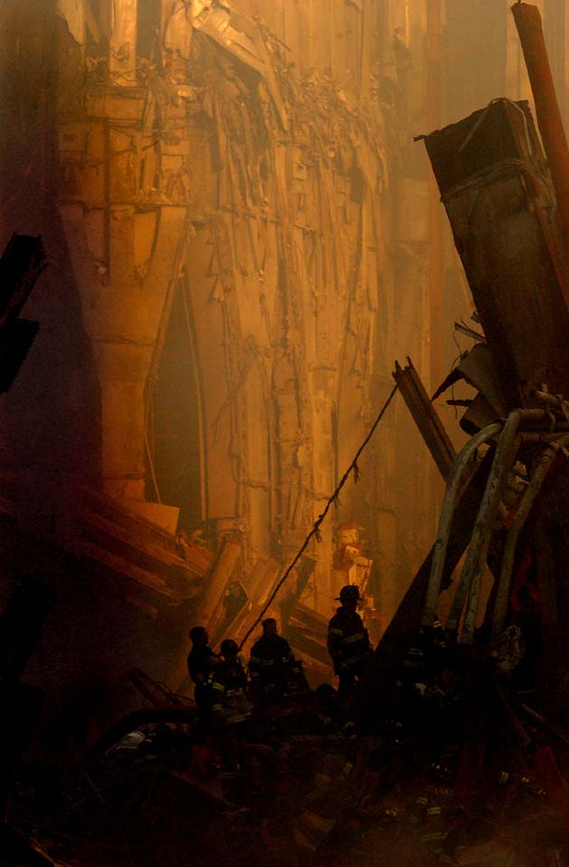 Rescue workers conduct search and rescue attempts, descending deep into the rubble of the World Trade Center in New York on Friday September 14, 2001.