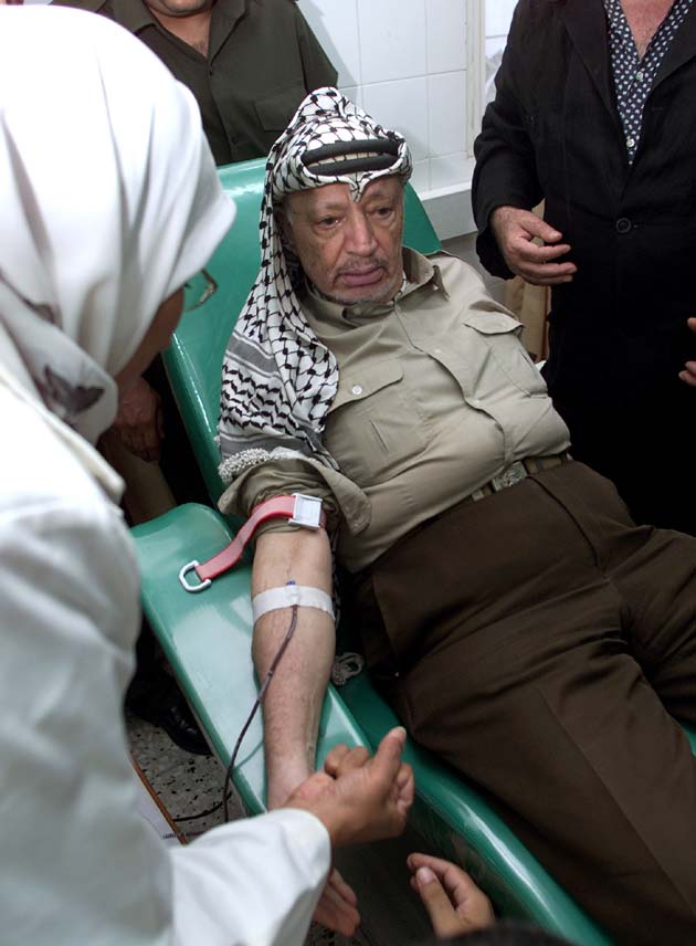 Palestinian President Yasser Arafat donates blood in Gaza hospital September 12, 2001, for the victims of yesterday's terrorist attacks in the United States. Palestinians said they sympathised with the victims of the attack in the United States despite their criticism of US support for Israel during the Palestinian uprising.