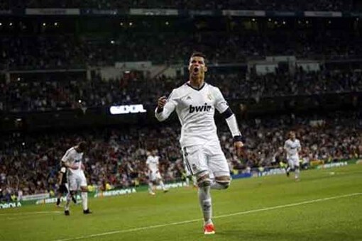 Real Madrid Thump Nine Man Malaga To Delay Barca Title