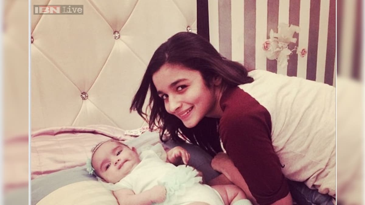 Snapshot: Alia Bhatt looks excited as she cuddles up to a baby girl