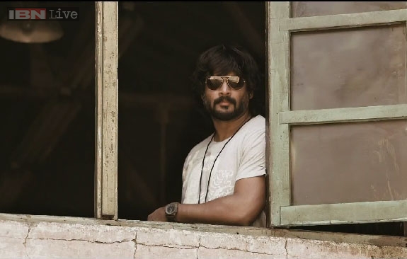 Irudhi suttru' first stills: R Madhavan is almost unrecognisable with his long hair, beard and bulging muscles Irudhi suttru' first stills: R Madhavan is almost unrecognisable with his long hair, beard and bulging muscles