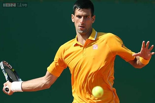 Novak Djokovic slides smoothly through in Monte Carlo