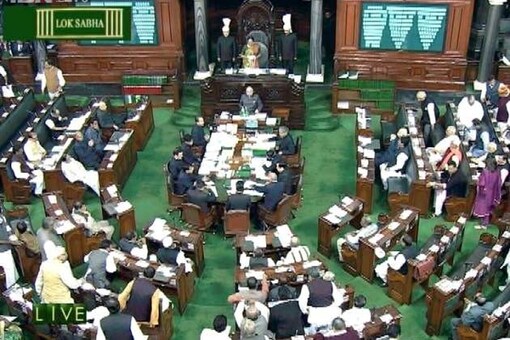 Opposition protests rock Lok Sabha, Speaker carries on proceedings in din