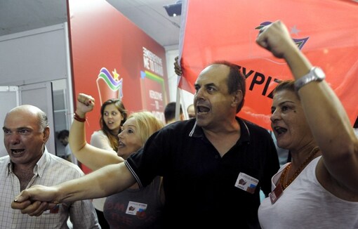 Supporters of leftist Syriza party react at the party's main election kiosk after seeing the results following a general election in Athens, Greec