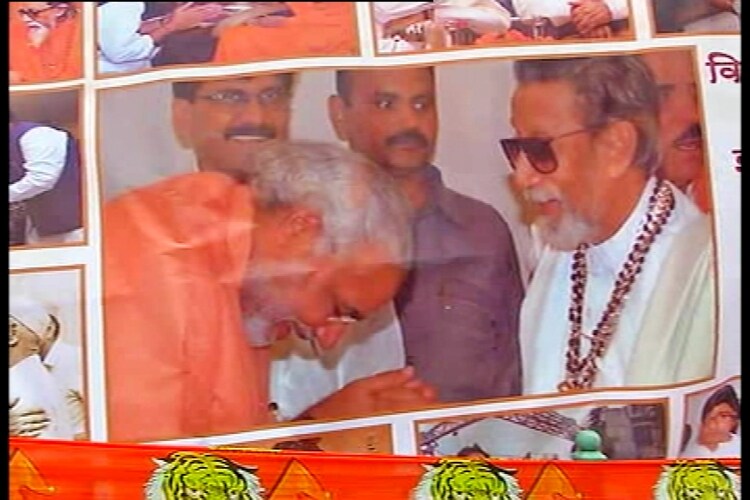 Shiv Sena removes controversial poster showing Modi, other BJP leaders bowing before Bal Thackeray Shiv Sena removes controversial poster showing Modi, other BJP leaders bowing before Bal Thackeray