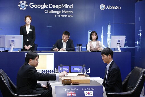 South Korean professional Go player Lee Sedol, right, watches as Google DeepMind's lead programmer Aja Huang, left, puts the Google's artificial intelligence program, AlphaGo's first stone during the final match of the Google DeepMind Challenge Match in Seoul, South Korea, Tuesday, March 15, 2016. (AP Photo/Lee Jin-man)