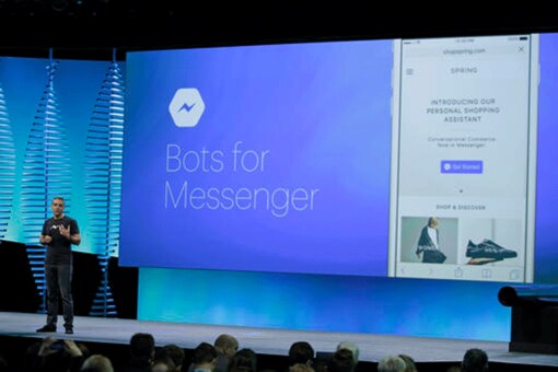 David Marcus, Facebook Vice President of Messaging Products, talks about bot for Messenger during the keynote address at the F8 Facebook Developer Conference Tuesday, April 12, 2016, in San Francisco. Facebook says people who use its Messenger chat service will soon be able to order flowers, request news articles and talk with businesses by sending them direct text messages. (AP Photo/Eric Risberg)