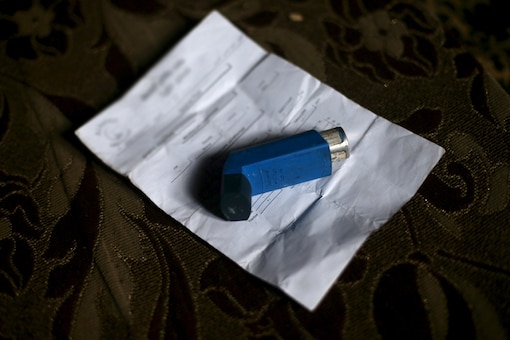 A bronchodilator placed atop of a prescription. (File Photo/Reuters)
