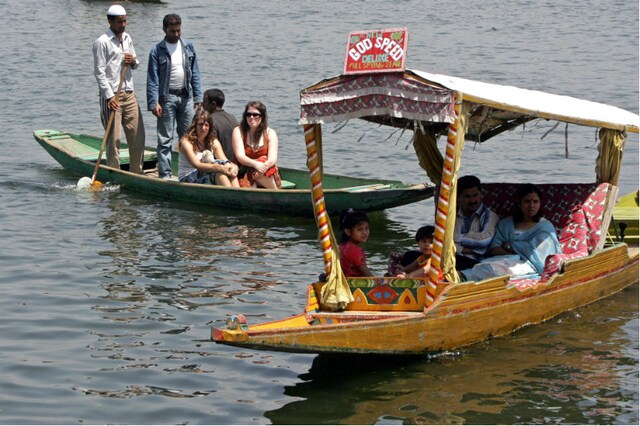 Tourists enjoy boat ride in shikaras on the waters of Kashmir's Dal Lake in Srinagar/Image only for representational purpose.