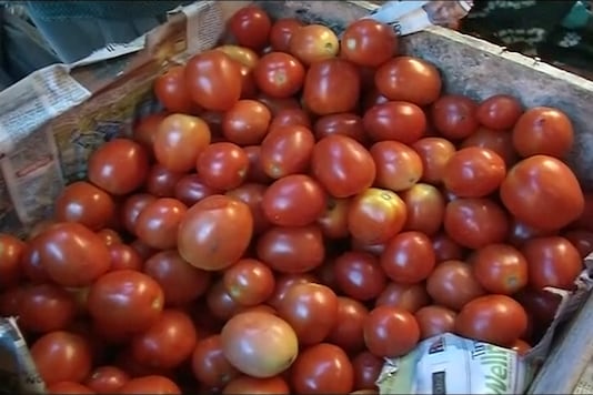 A picture showing a stack of tomatoes. A picture showing a stack of tomatoes.