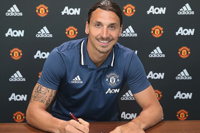 Zlatan Ibrahimovic poses after signing for the club at Aon Training Complex.  (Photo Credit: Getty Images)
