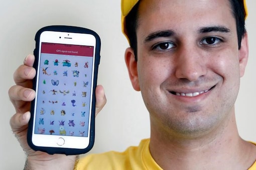 Nick Johnson, the first person to beat 'Pokemon Go' and capture all 145 Pokemon, poses with his mobile phone showing Pokemon characters he captured in Tokyo, Japan, August 8, 2016. REUTERS/Kim Kyung-Hoon