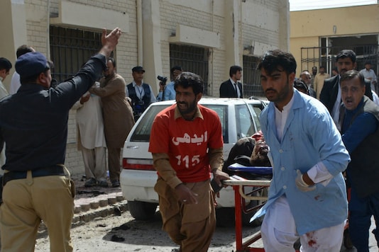 Pakistani volunteers rush an injured person for medical help following a bomb blast in Quetta, Pakistan (Picture courtesy: AP) Pakistani volunteers rush an injured person for medical help following a bomb blast in Quetta, Pakistan (Picture courtesy: AP)
