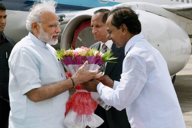 In this file photo, Telangana Chief Minister K. Chandrasekhar Rao (right) greets Prime Minister Narendra Modi. (Photo: PTI)