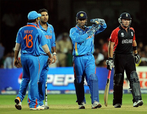 India cricket captain Mahendra Singh Dhoni gestures for a review of a not-out decision by the umpire. (Getty Images)