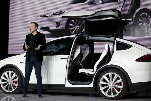 Tesla CEO Elon Musk with Tesla Model X. (Photo: Reuters)