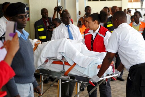 
A man injured during an attack on a residential complex in Soko Mbuzi village of Mandera town at the Kenya-Somalia border is wheeled on a stretcher as he arrives at the Kenyatta National Hospital in Kenya's capital Nairobi, July 7, 2015. (Photo Courtesy: Reuters) 