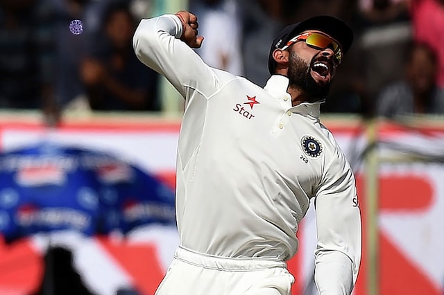 Indian Captain Virat Kohli celebrates the prized wicket of Alasair Cook during the second day of the Vizag Test. (AFP Images)