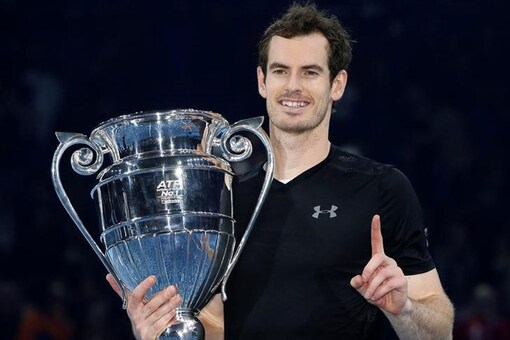 Great Britain's Andy Murray celebrates winning the final against Serbia's Novak Djokovic with the ATP World Tour Finals trophy. (Photo Courtesy: Reuters)