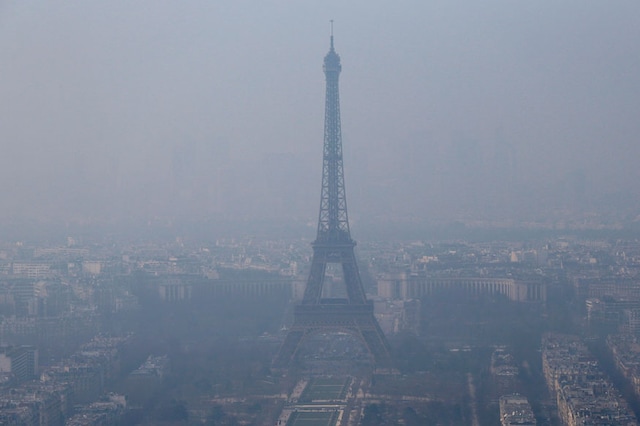 A general view shows the Eiffel Tower and the Paris skyline through a small-particle haze. (Reuters)