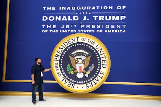 Workers install the presidential seal at the site of the Commander in Chief inaugural ball for President-elect Donald Trump in Washington (Reuters) Workers install the presidential seal at the site of the Commander in Chief inaugural ball for President-elect Donald Trump in Washington (Reuters)