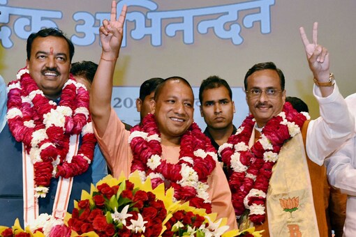 BJP's  Yogi Adityanath (C) elected leader of the BJP Legislature Party (Chief Minister Uttar Pradesh)  K P Murya (L Deputy CM) and Dinesh Sharma (R Deputy CM) showing victory sign after the meeting  in Lucknow on Mar 18, 2017. (PTI Photo).