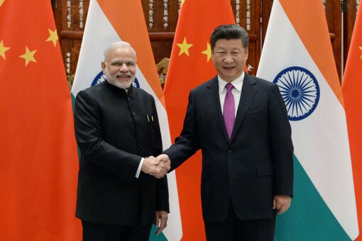 In this file photo, Prime Minister Narendra Modi poses with Chinese President Xi Jinping. (File photo/AP)