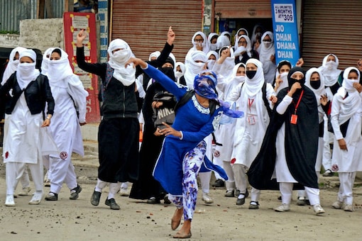 In April this year, for the first time in the Valley, thousands of students across schools and colleges erupted in anger. For the first time, one saw images of young school girls flinging stones at security forces in Kashmir. (PTI Photo)