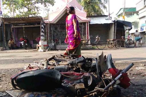 A burnt motorcycle  seen at a road after a communal riot at Baduria, a town in Basirhat sub-division in North 24 Parganas district of West Bengal. (Photo: Sujit Nath)