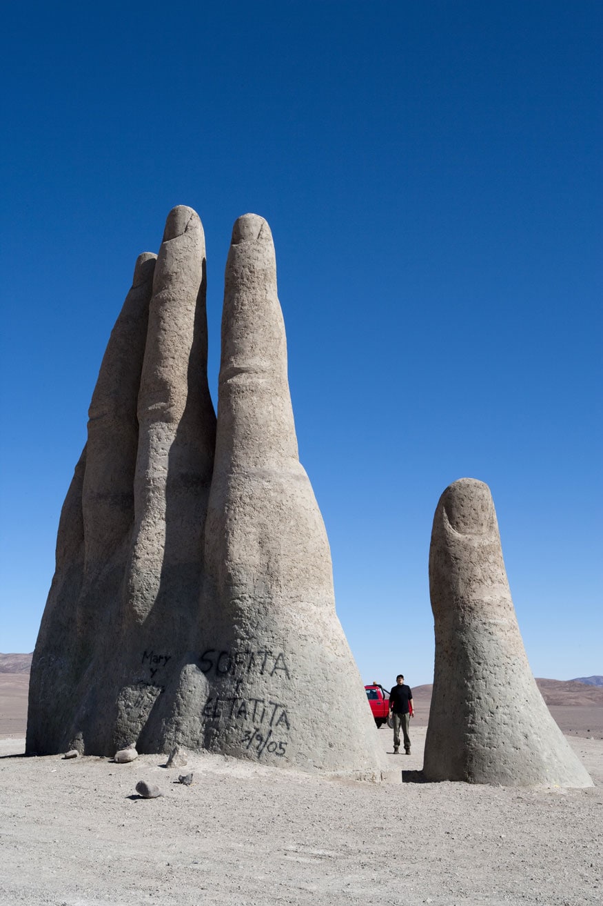 Hand of the Desert sculpture by Chilean artist Mario Irarrazabal. The sculpture of a giant hand rising from the ground is located in the Atacama Desert near Antofagasta, Chile. (Image: Getty Images)